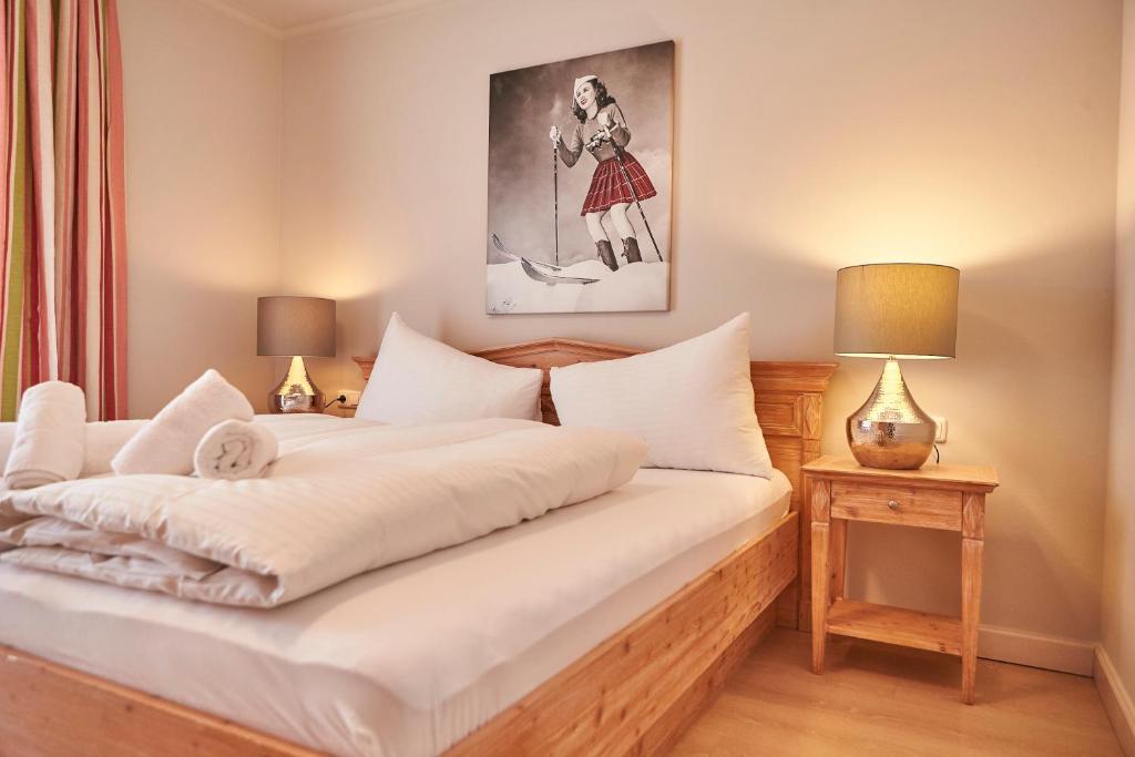 Posteľ alebo postele v izbe v ubytovaní Hüttl Relax Appartements