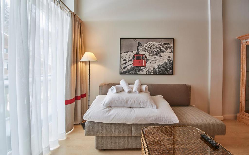 Posteľ alebo postele v izbe v ubytovaní Hüttl Relax Appartements