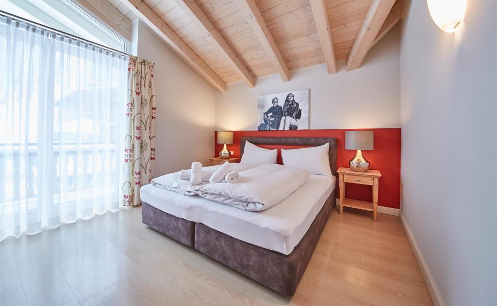 Posteľ alebo postele v izbe v ubytovaní Hüttl Relax Appartements
