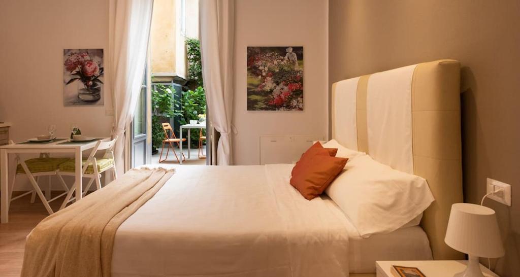 En eller flere senge i et værelse på Casa di Jo