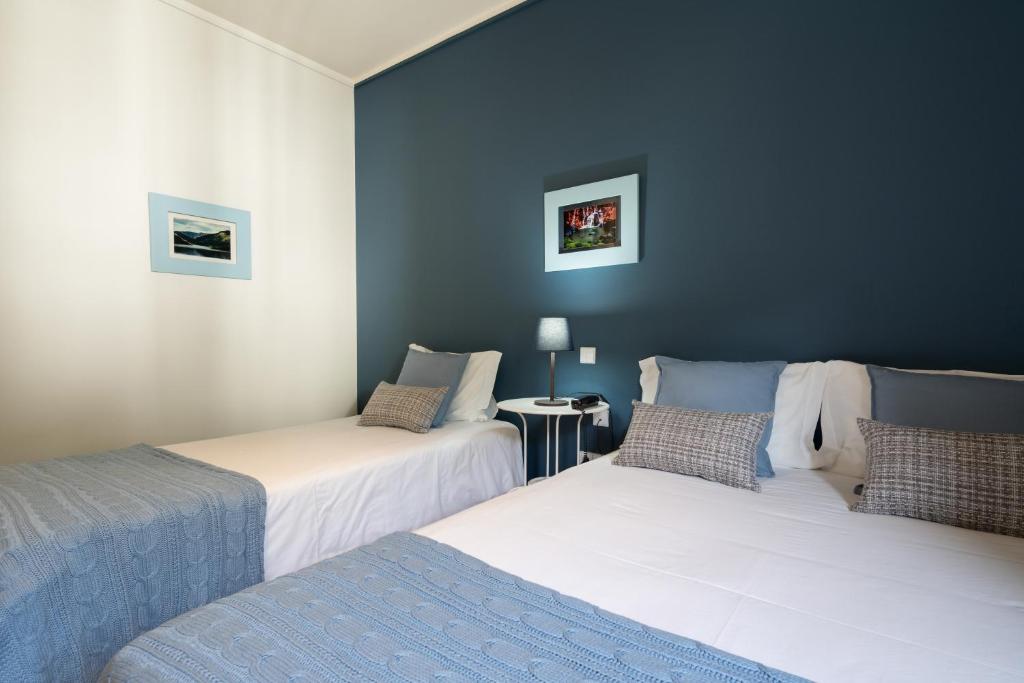 Postel nebo postele na pokoji v ubytování Hotel Carvalho Araujo