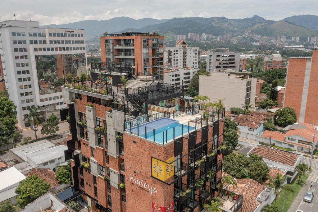 an aerial view of a city with buildings at Masaya Medellin in Medellín