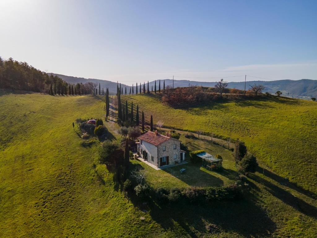 an aerial view of a small house in a field at Poggio Bicchieri in Campiglia dʼOrcia
