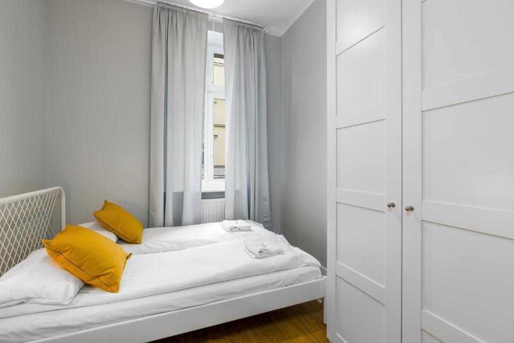 Posteľ alebo postele v izbe v ubytovaní Old Town Apartment Garbary by Noclegi Renters