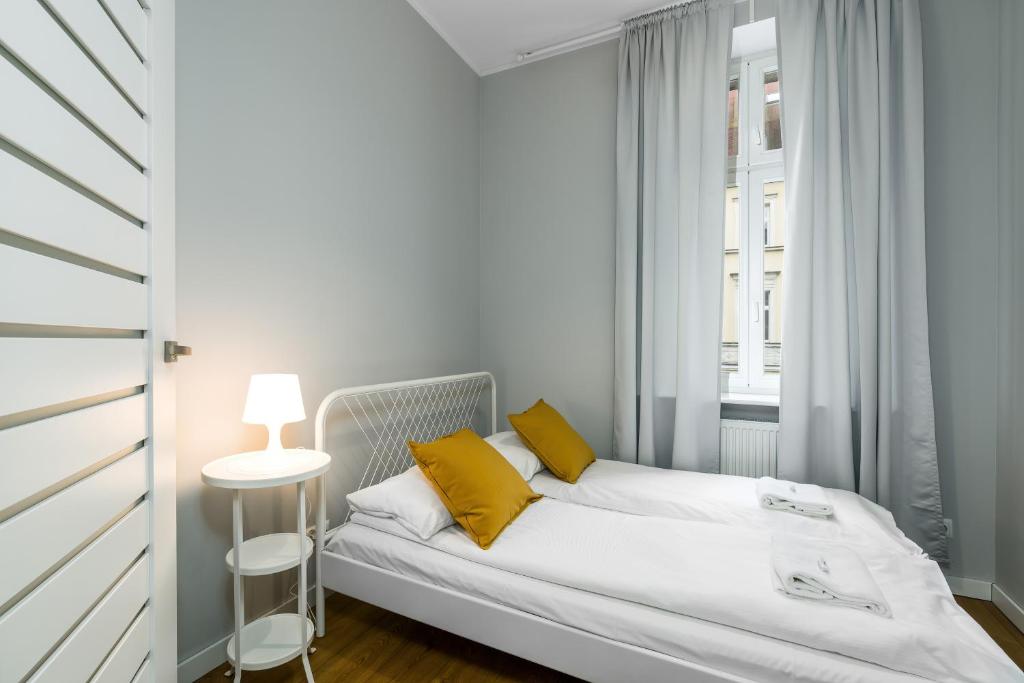 Posteľ alebo postele v izbe v ubytovaní Old Town Apartment Garbary by Noclegi Renters