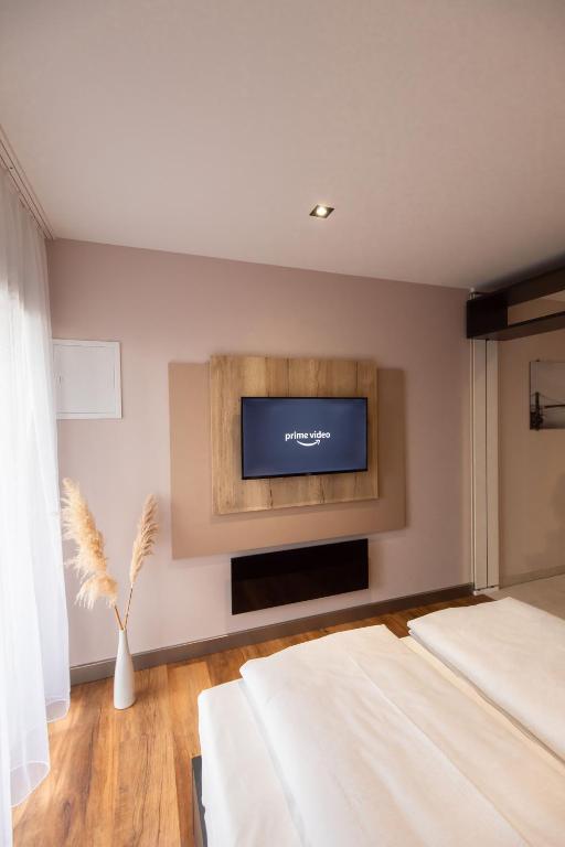 Postel nebo postele na pokoji v ubytování 24Seven Hotel Schwabach