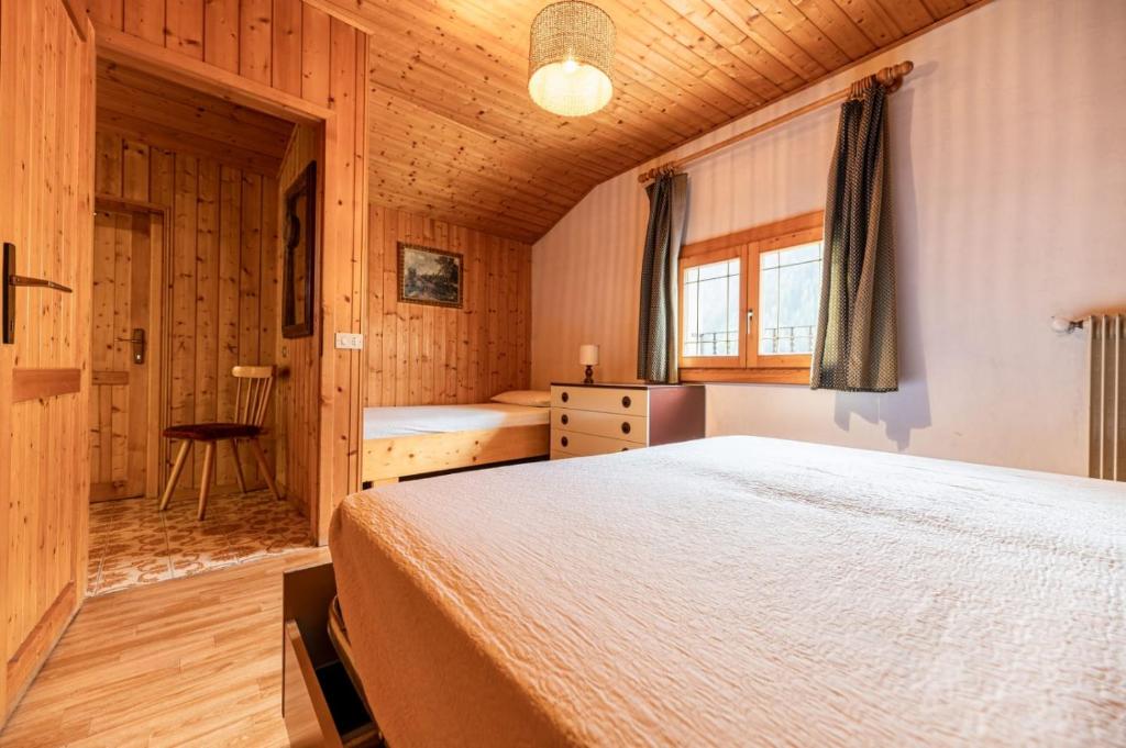 Postel nebo postele na pokoji v ubytování BBQUEEN Casa VACANZE AI CAPRIOLI