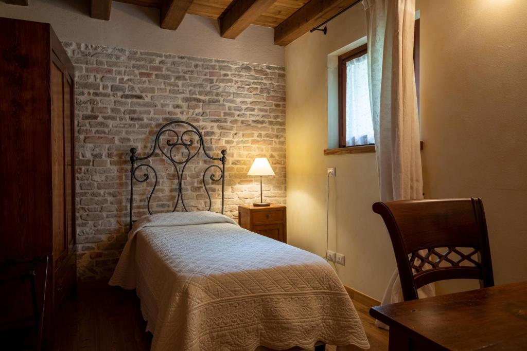 Postel nebo postele na pokoji v ubytování Ca' Muliner