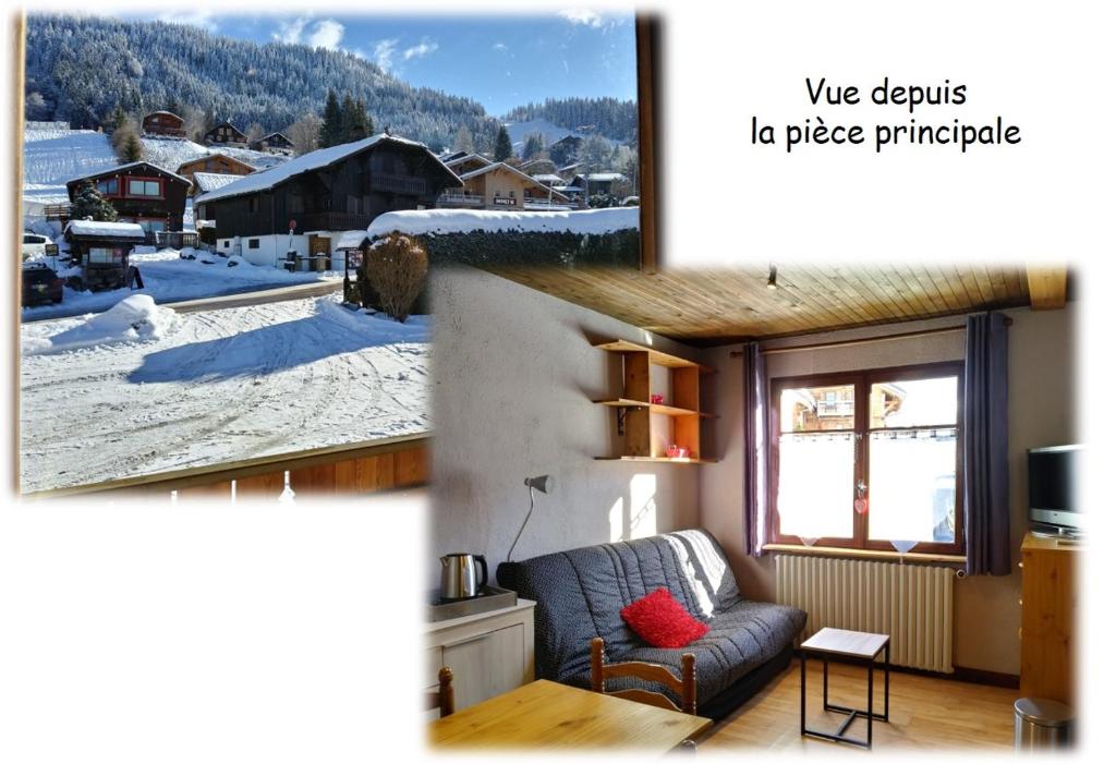 a living room with a couch in the snow at Le Si-près Pied des pistes in Les Carroz d'Araches