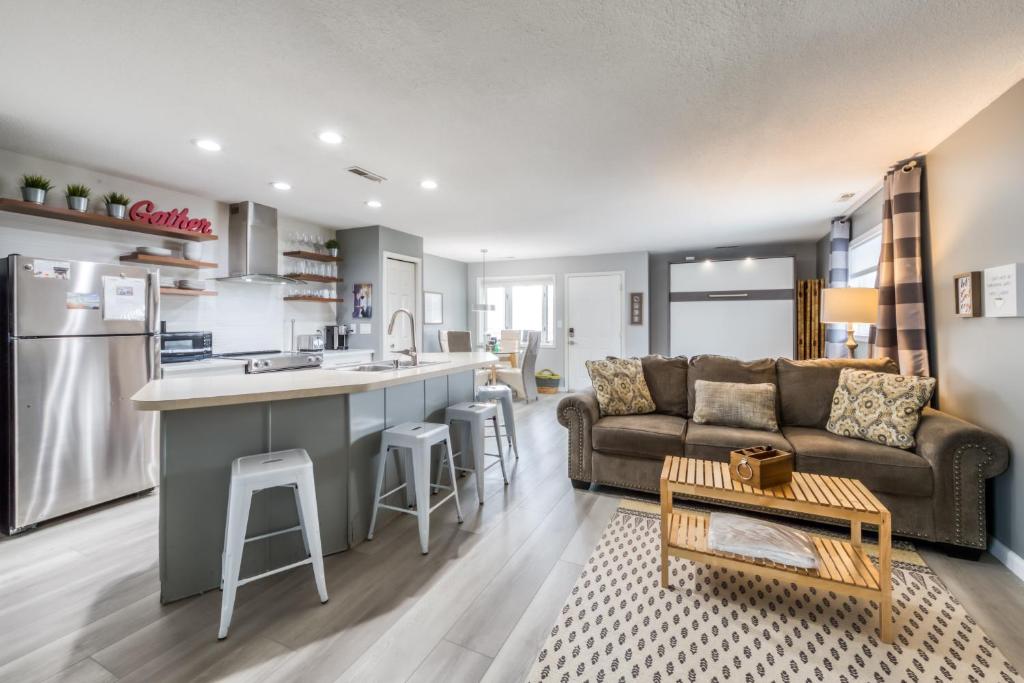 a kitchen and living room with a couch and a table at Tiffanie By The Sea in Ocean City