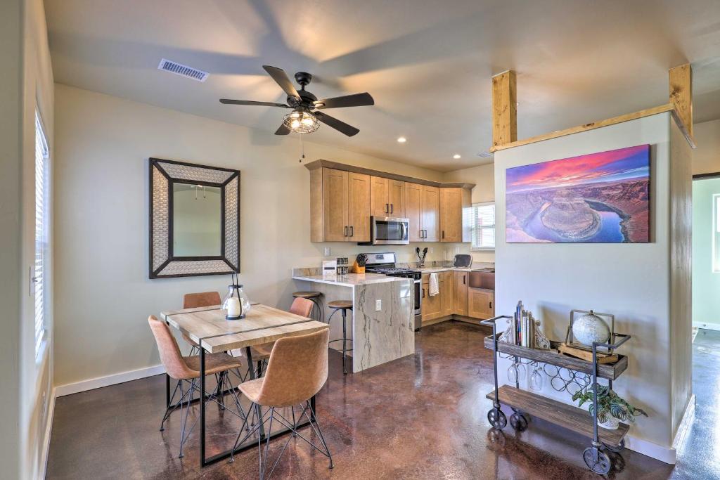 a kitchen and dining room with a table and a ceiling fan at Modern Boho Retreat 3 Blocks to Dtwn and Rte 66 in Williams