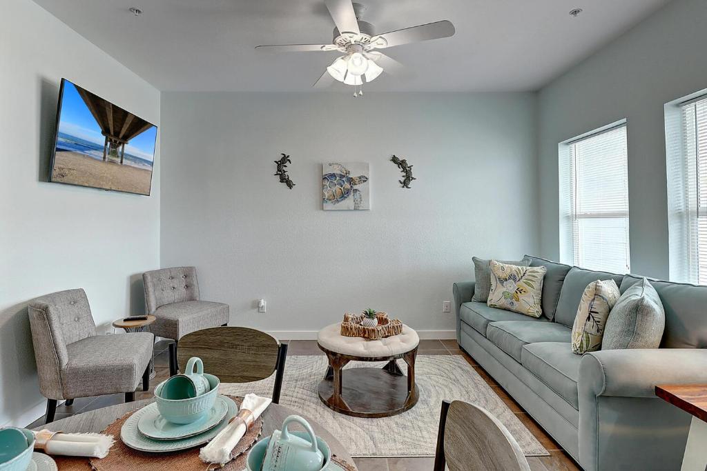 a living room with a couch and a table at I am So Swamped in Port Aransas
