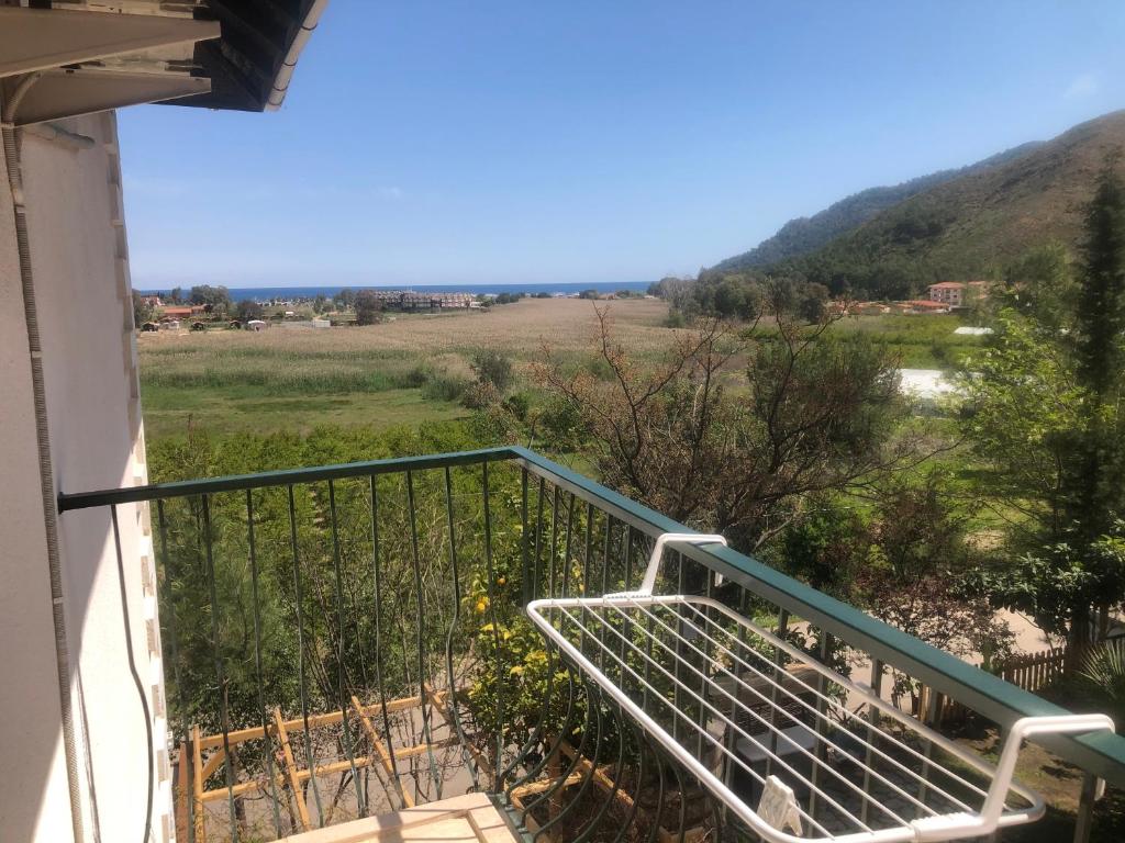 a balcony with a view of a field at Swiss Eviniz Hotel in Adrasan
