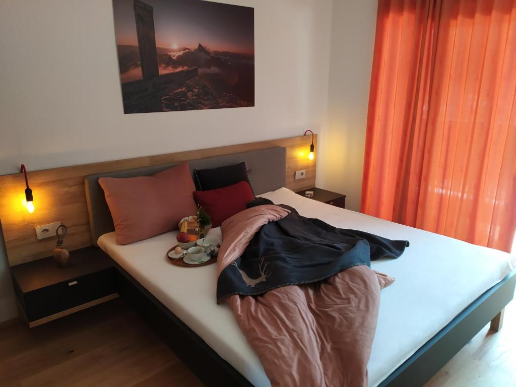 Postel nebo postele na pokoji v ubytování Apartments Ban Guggugg