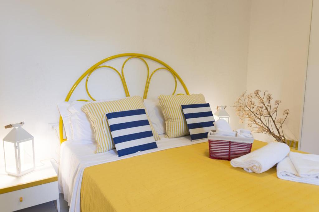 A bed or beds in a room at Terrazze di Chia