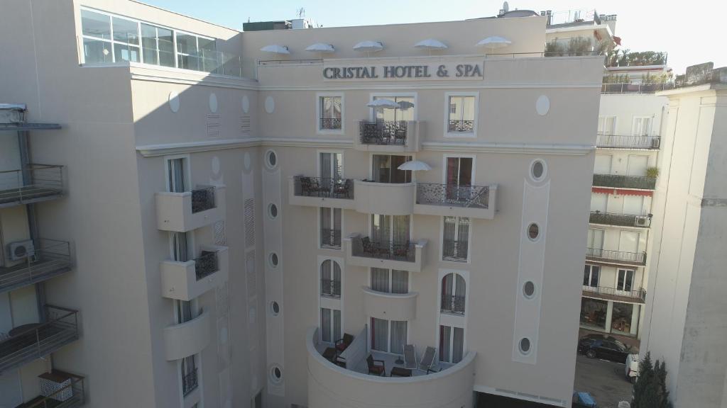 an external view of a building with balconies at Cristal Hôtel & Spa in Cannes