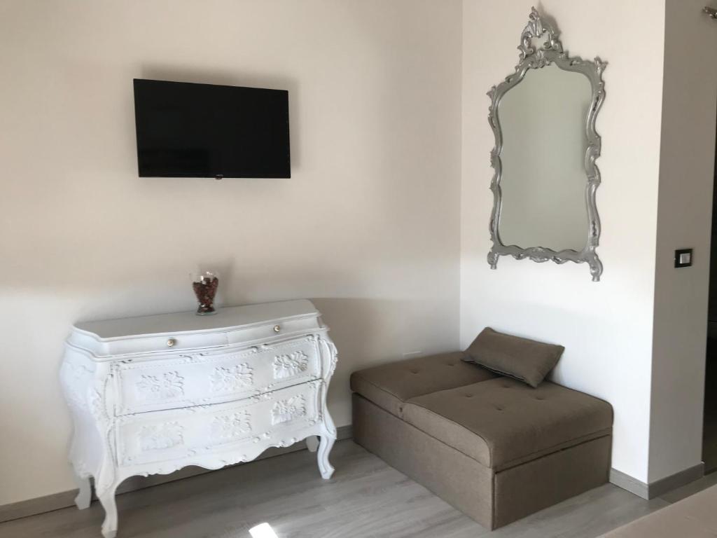 Televízia a/alebo spoločenská miestnosť v ubytovaní ATTICO LIVORNO Bed & Relax