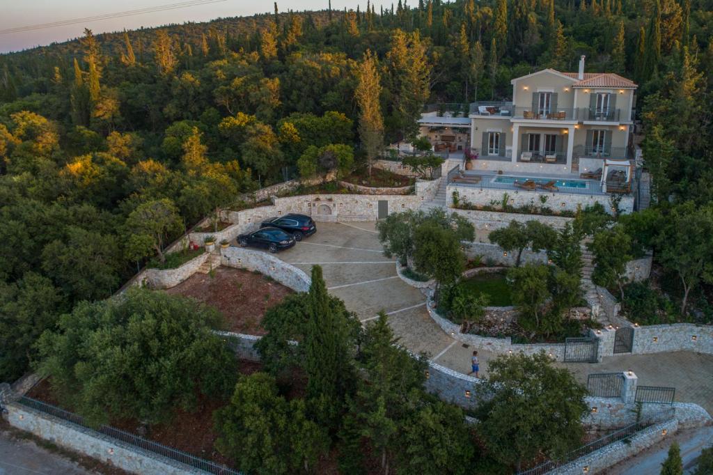 an aerial view of a house with a yard at Luxury Villa Fiscardo Walk - Heated Pool & Jacuzzi in Fiskardo