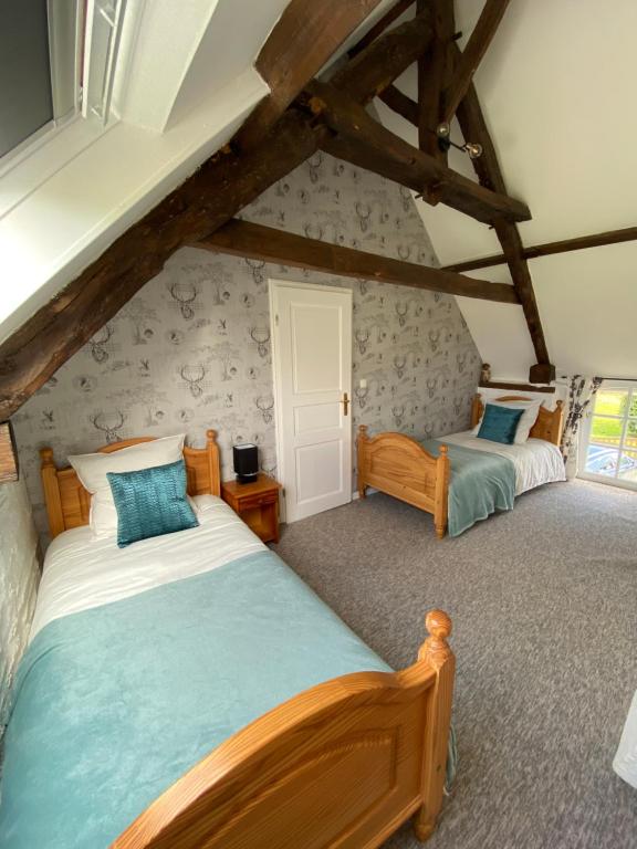 Postel nebo postele na pokoji v ubytování La Petite Maison - No 4 La Relierie