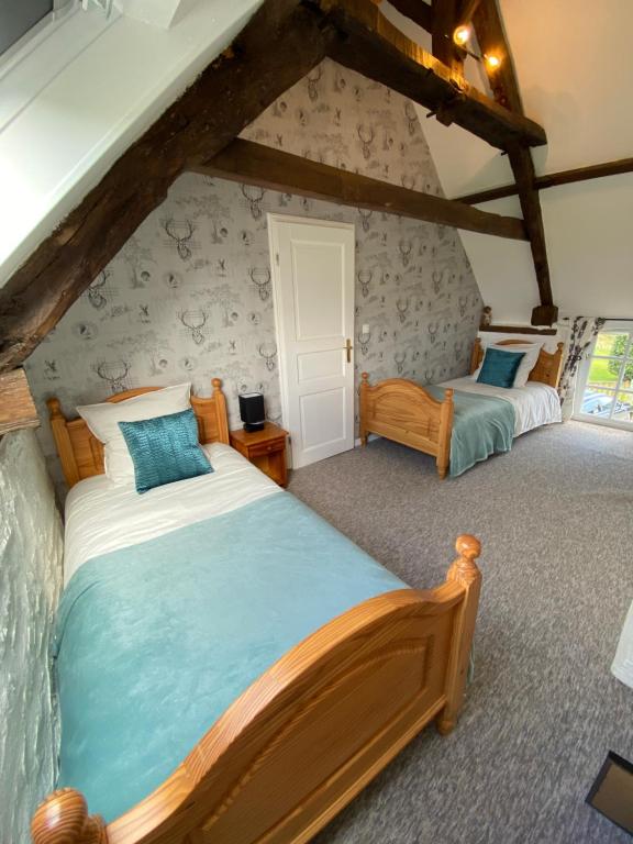 Postel nebo postele na pokoji v ubytování La Petite Maison - No 4 La Relierie