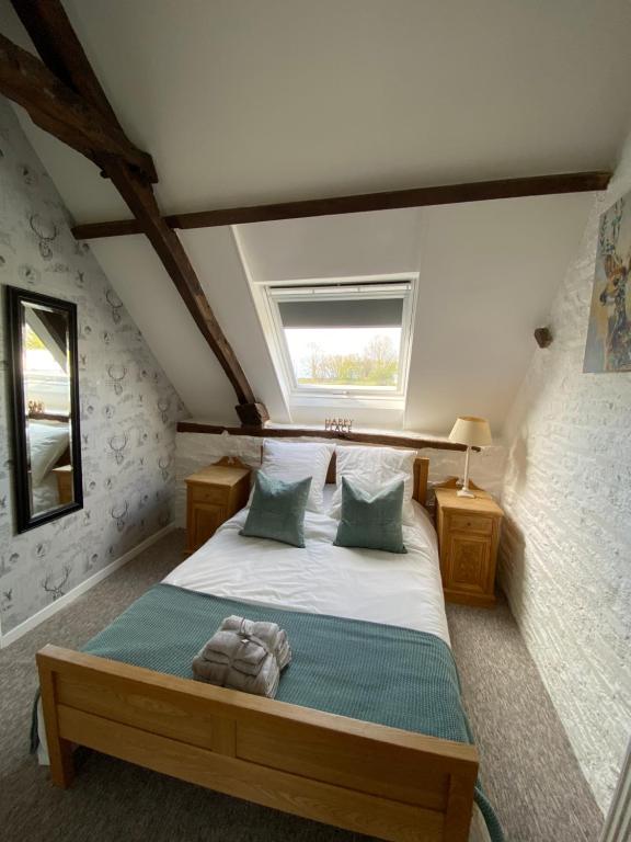 Postel nebo postele na pokoji v ubytování La Petite Maison - No 4 La Relierie