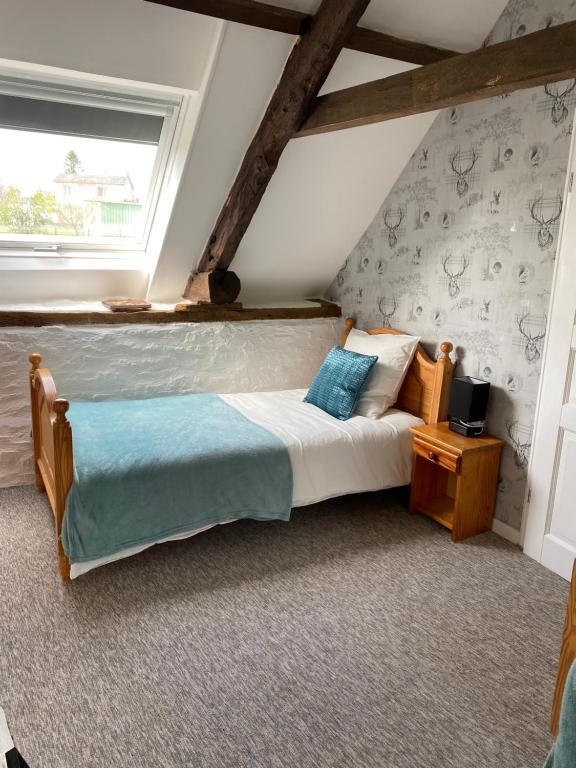 Postel nebo postele na pokoji v ubytování La Petite Maison - No 4 La Relierie
