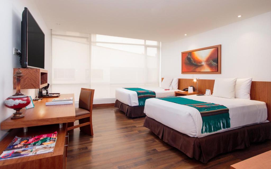Postel nebo postele na pokoji v ubytování ZEN Hotel