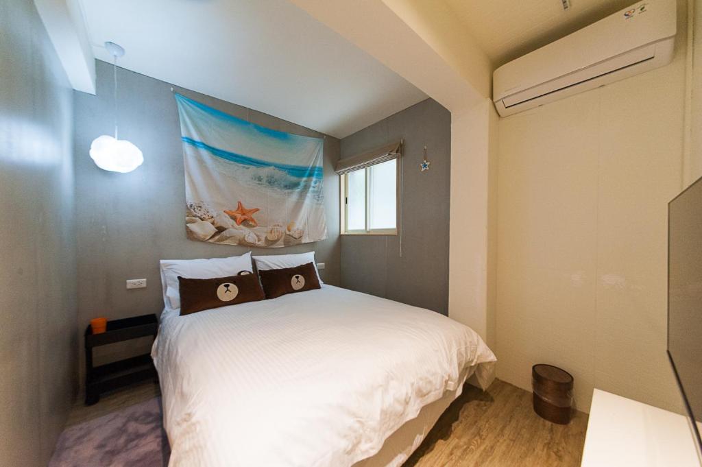 Postel nebo postele na pokoji v ubytování Mu sun Villa 慕山休閒包棟民宿 宜蘭縣民宿2060號