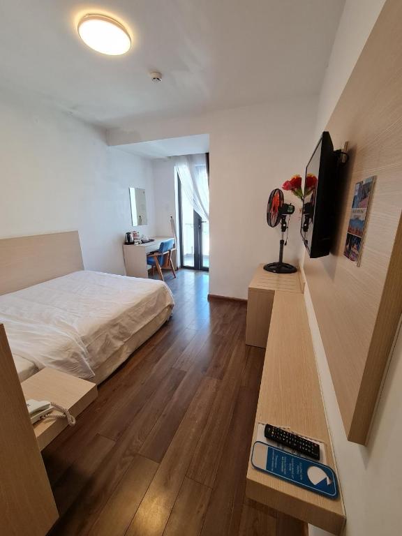 Postel nebo postele na pokoji v ubytování Ngan Hoa - Mille Fleurs