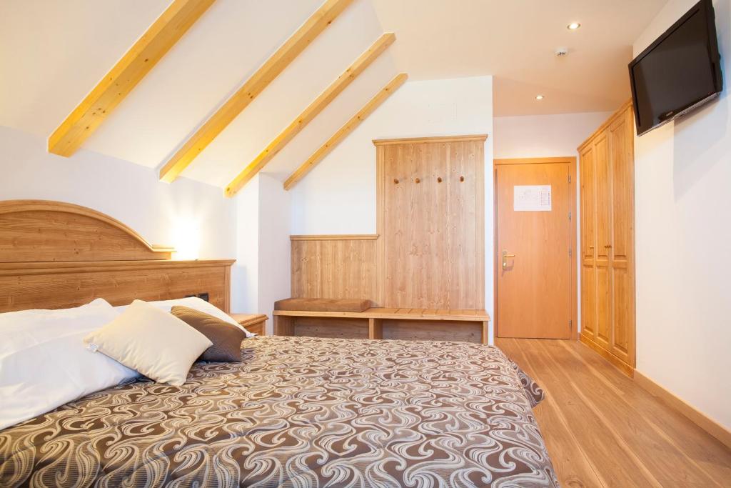 Postel nebo postele na pokoji v ubytování Hotel Vittoria