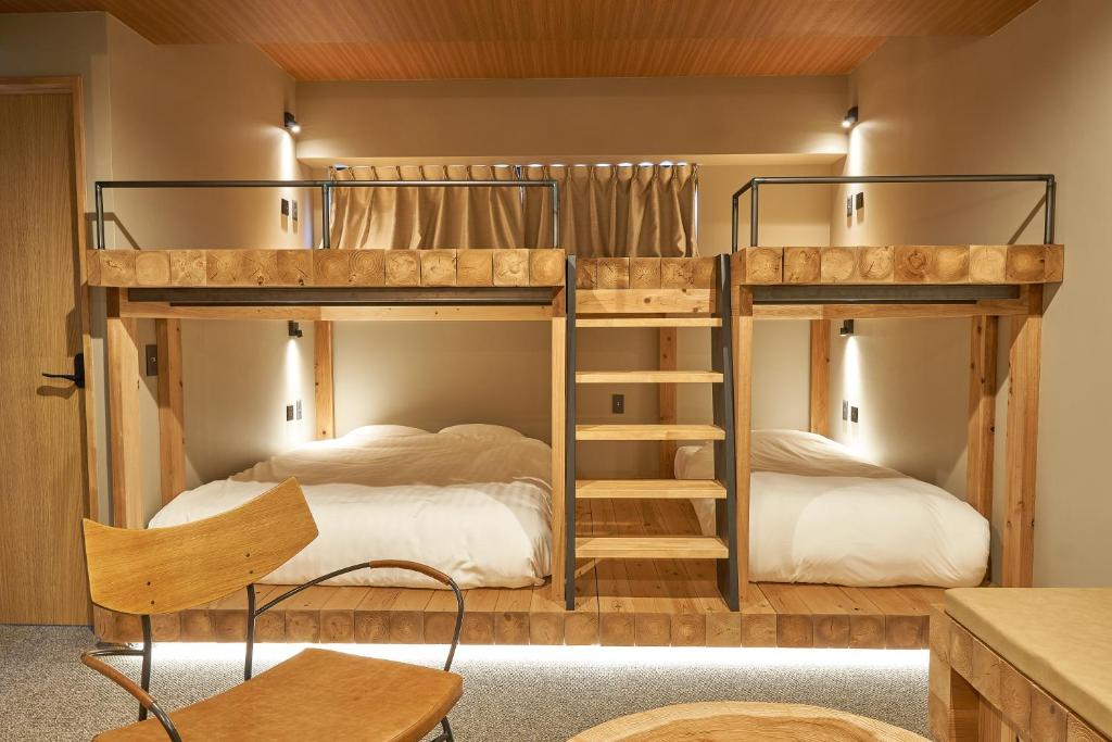 Postel nebo postele na pokoji v ubytování mizuka Daimyo 7 - unmanned hotel -