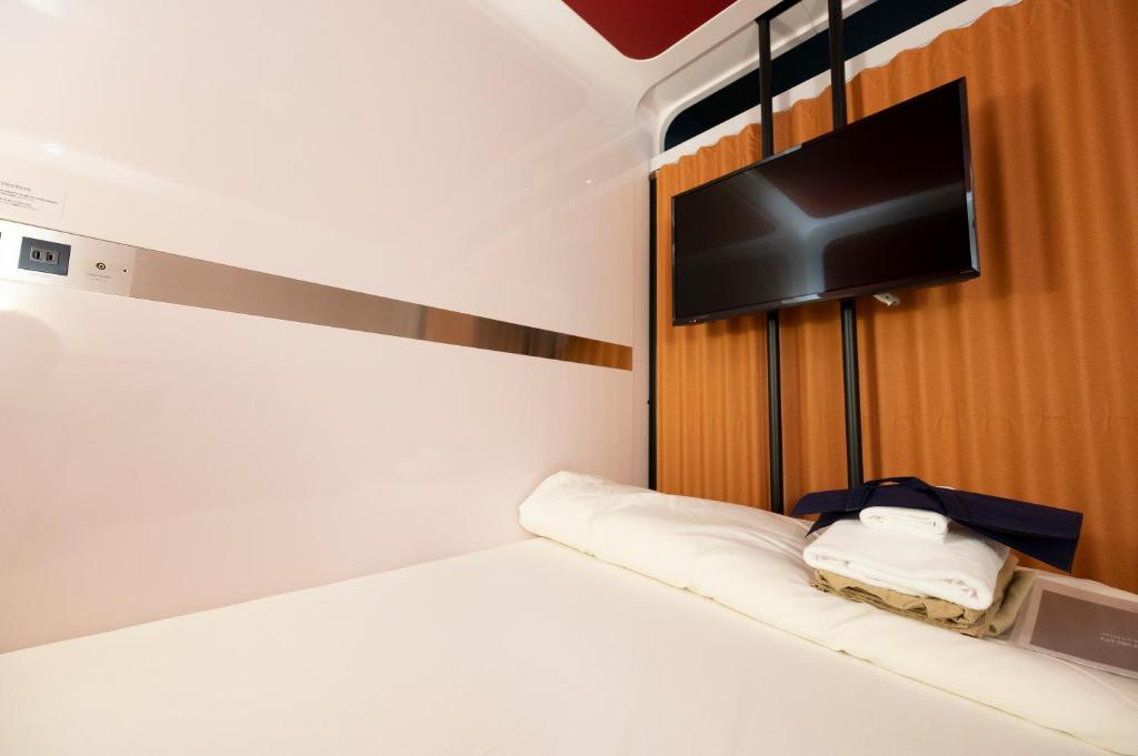 Postel nebo postele na pokoji v ubytování Torifito Hotel & Pod Kanazawa