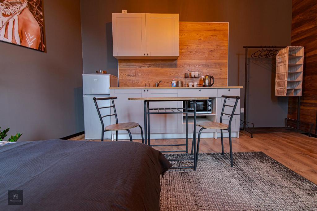 Kuchyňa alebo kuchynka v ubytovaní Apartamenty Wyszyńskiego 2