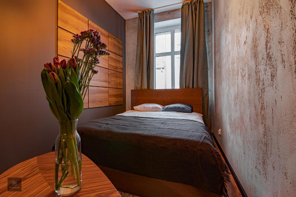 Posteľ alebo postele v izbe v ubytovaní Apartamenty Wyszyńskiego 2
