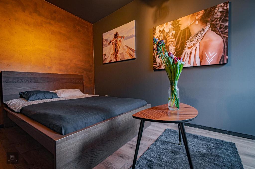 Posteľ alebo postele v izbe v ubytovaní Apartamenty Wyszyńskiego 2