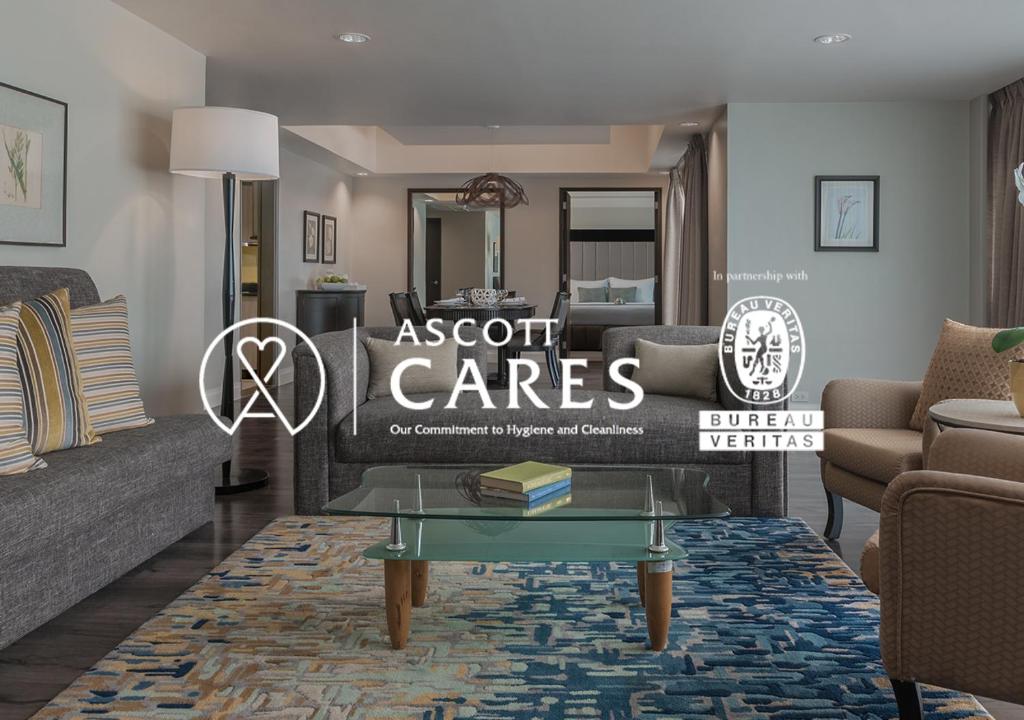 a living room with a couch and a table at Citadines Salcedo Makati in Manila