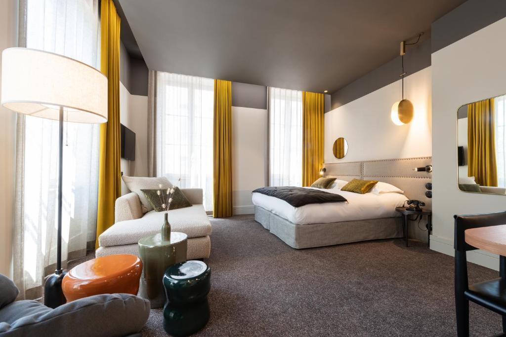 Postel nebo postele na pokoji v ubytování Hôtel de l'Abbaye Lyon - Boutique Hôtel
