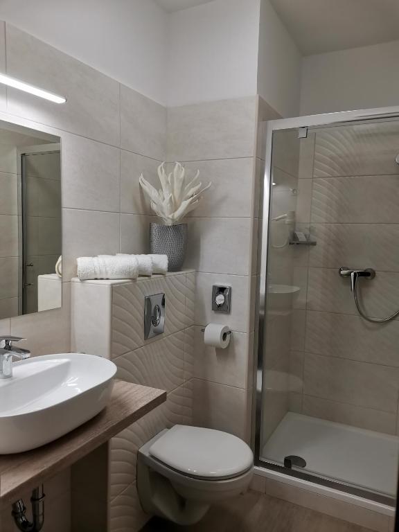 Kúpeľňa v ubytovaní Alfa Hotel