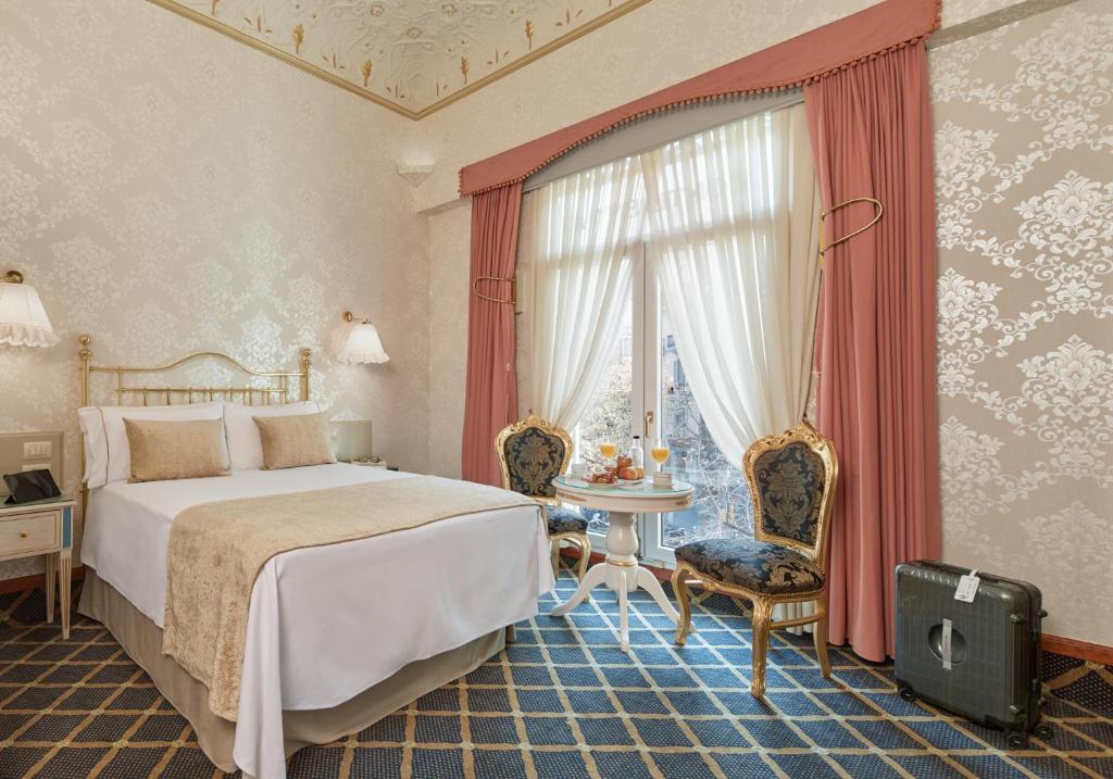 Ліжко або ліжка в номері Hotel Continental Palacete