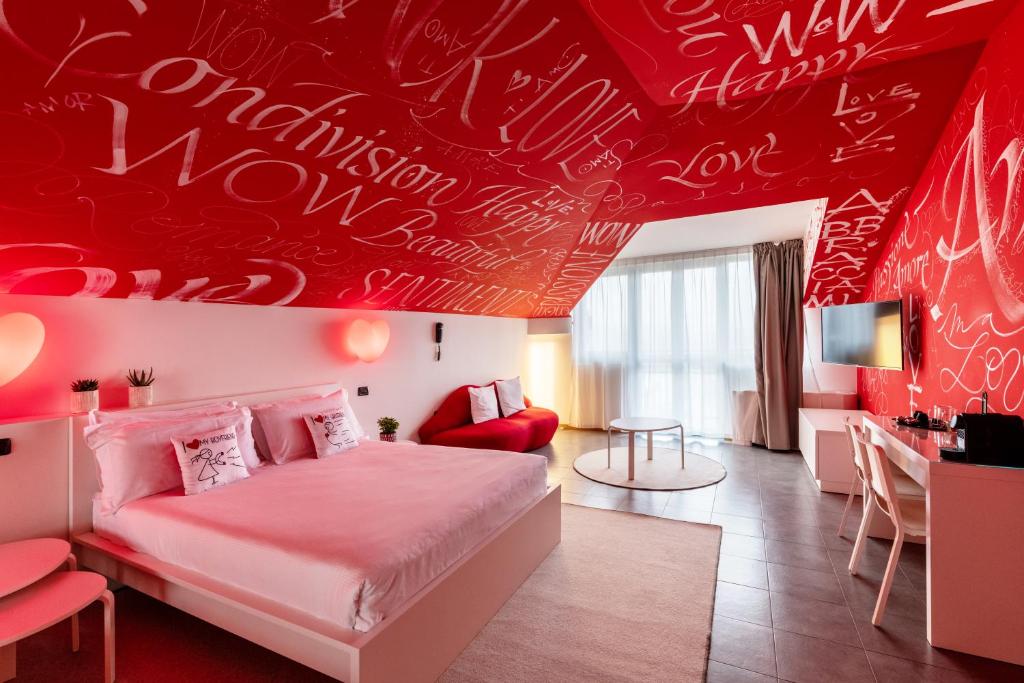 Postel nebo postele na pokoji v ubytování Hotel Borgo Brianteo