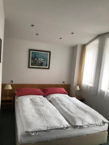 Postel nebo postele na pokoji v ubytování Hotel Occam
