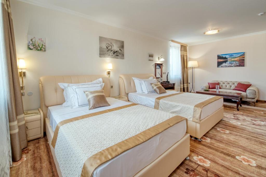 A bed or beds in a room at Residence Konstantina Palace