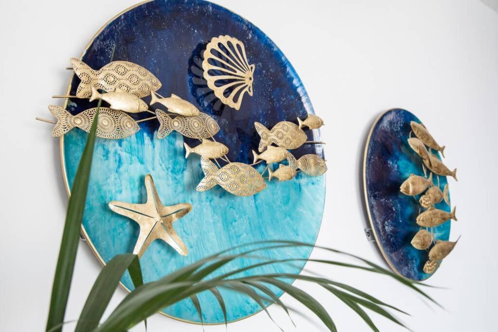 a blue plate with turtles and shells on it at Panoramic Ocean view in Puerto de Santiago
