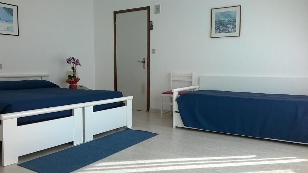 Postel nebo postele na pokoji v ubytování Hotel King