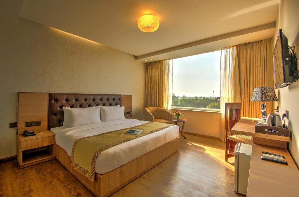 TV a/nebo společenská místnost v ubytování Hotel 91 Huda City Centre