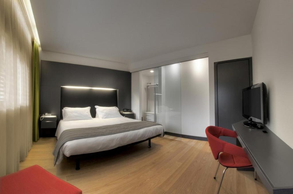 Posteľ alebo postele v izbe v ubytovaní Mercure Nerocubo Rovereto
