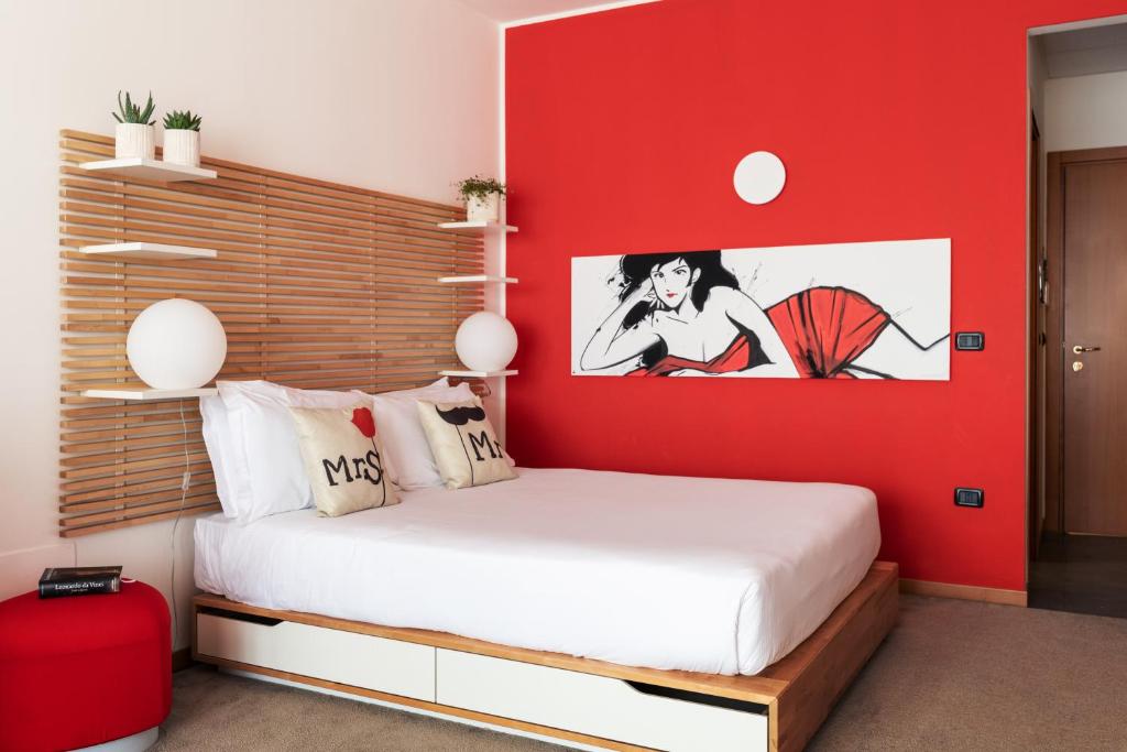 Postel nebo postele na pokoji v ubytování Hotel Borgo Brianteo