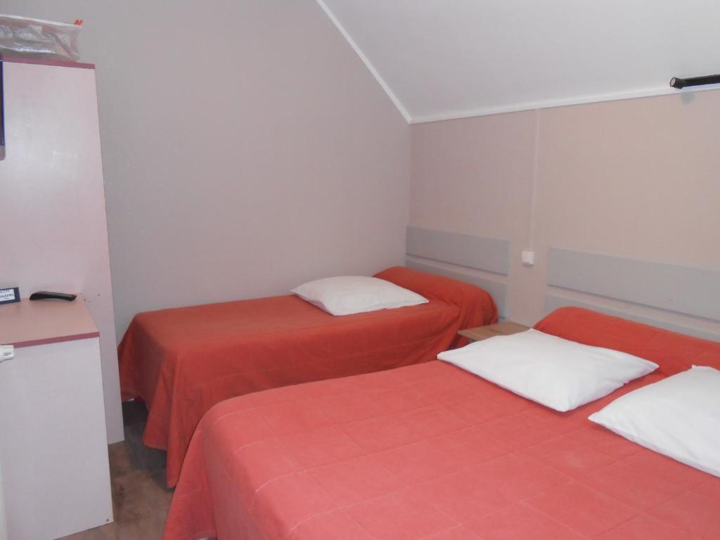 Postel nebo postele na pokoji v ubytování Hotel & Restaurant Hanoï Station