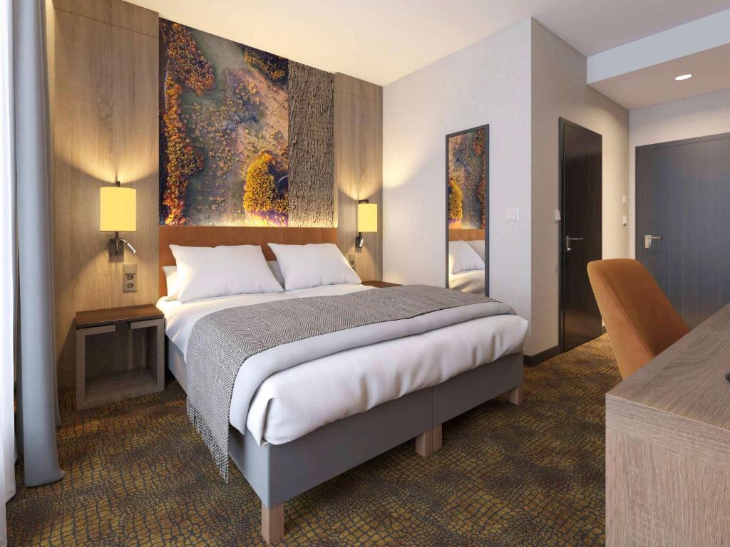 Postel nebo postele na pokoji v ubytování Mercure Bialystok