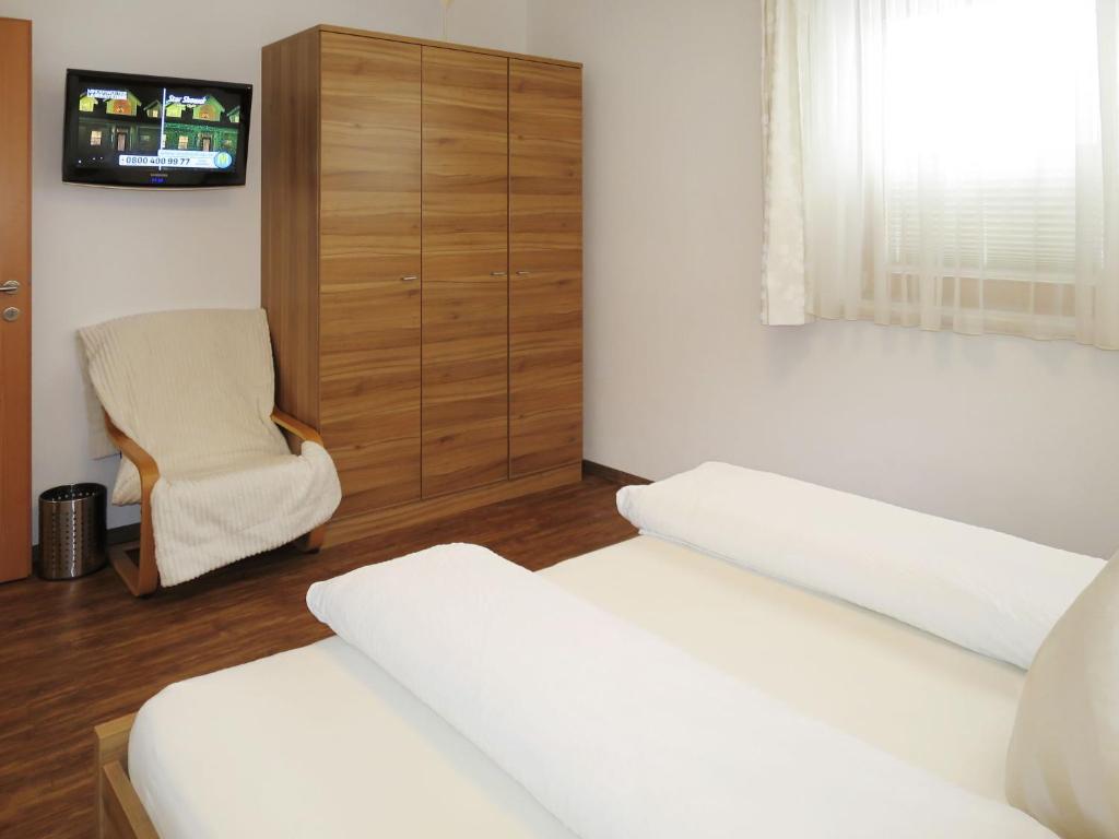 Televízia a/alebo spoločenská miestnosť v ubytovaní Apartment Marina by Interhome